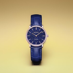 May include: A blue leather wristwatch with a rose gold case and a blue dial with a starry pattern. The watch face has a diamond bezel and the text "ZENGORI SAPPHIRE" printed on it.