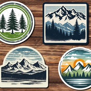 May include: Four vintage-style stickers featuring mountain and forest scenes. The stickers are circular and rectangular with a distressed, faded look. The colors are muted and earthy, with shades of blue, green, brown, and white.