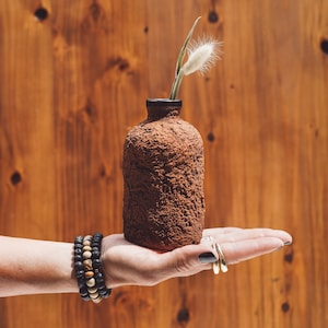 Amber Glass Bottle Vase with Textured Terra Cotta Concrete Exterior