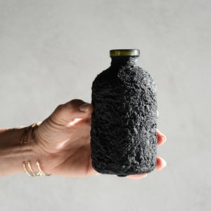 Black Concrete Bottle Vase with Olive Glass Rim image 1