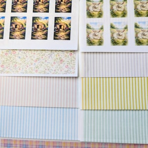 May include: Sheets of printed paper with various designs. Includes images of a tomb, lambs in a field, floral patterns, and striped and plaid backgrounds. The color palette is soft, featuring pastels and earth tones.