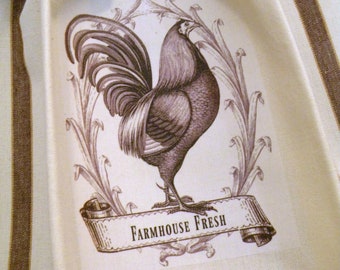 May include: A white kitchen towel with brown stripes features a vintage illustration of a rooster with the text "Farmhouse Fresh".