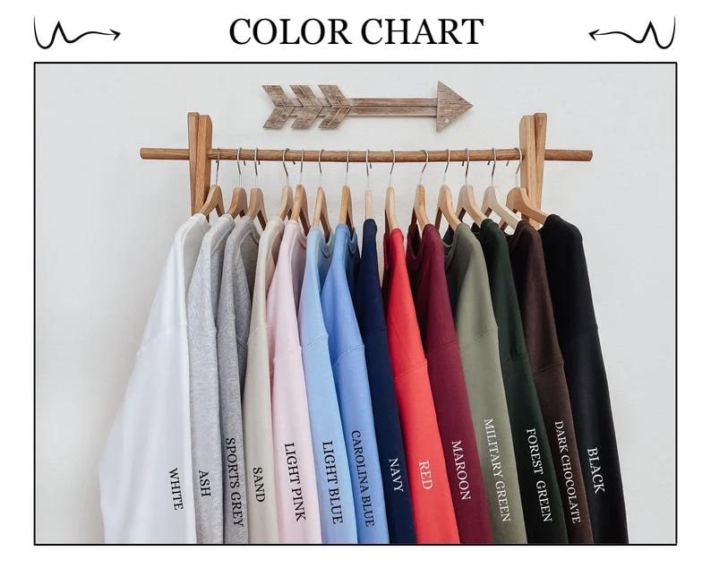 May include: Color chart showing 12 different sweatshirt colors, including white, ash, sports grey, sand, light pink, light blue, carolina blue, navy, red, maroon, military green, forest green, and dark chocolate.