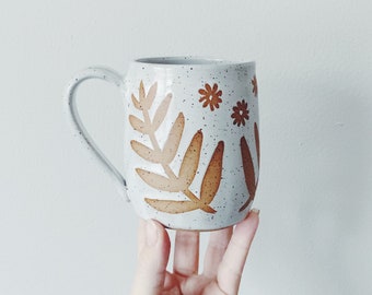 White Garden Ceramic Mug, white coffee cup with leaf and flower designs, speckled white pottery wheel thrown white mug