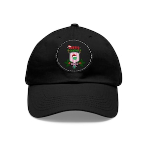 May include: Black baseball cap with a circular patch featuring a green and pink Christmas ornament with a Santa hat and the text "Merry Christmas".
