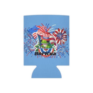 May include: A light blue can cooler featuring a patriotic frog wearing a hat and holding a flag. The design includes fireworks, an American flag, and a sunflower. The word "Boricua" is printed at the bottom.