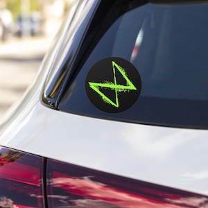May include: A green and black car sticker with a stylized lightning bolt design.