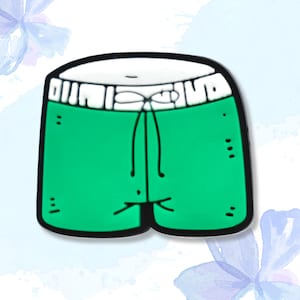May include: Green cartoon swim trunks with a white waistband and drawstring. The trunks have a black outline.