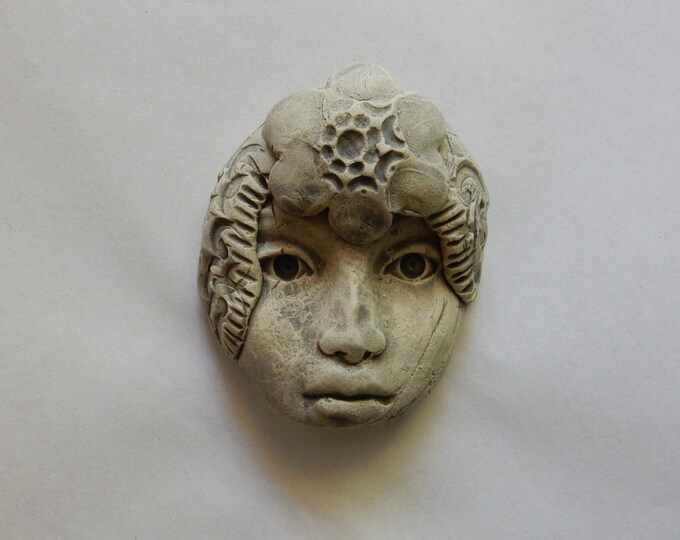 One Bisque Earthenware Face With a Wash of Kiln Fired Underglaze Color