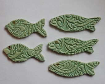 5 matte green patina glazed ceramic mosaic tile fish with embossed texture