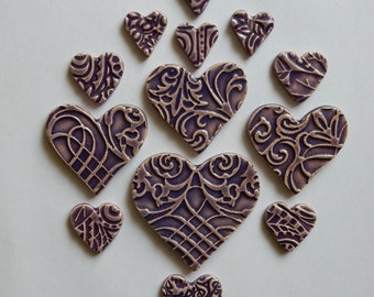 HEARTS...handmade embossed kiln fired earthenware clay hearts...(several sizes glazed in custom purple)