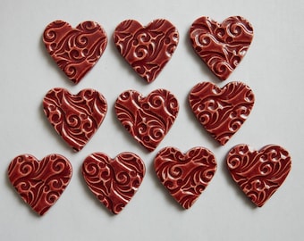 10 handmade embossed kiln fired earthenware clay hearts...cherry red glaze