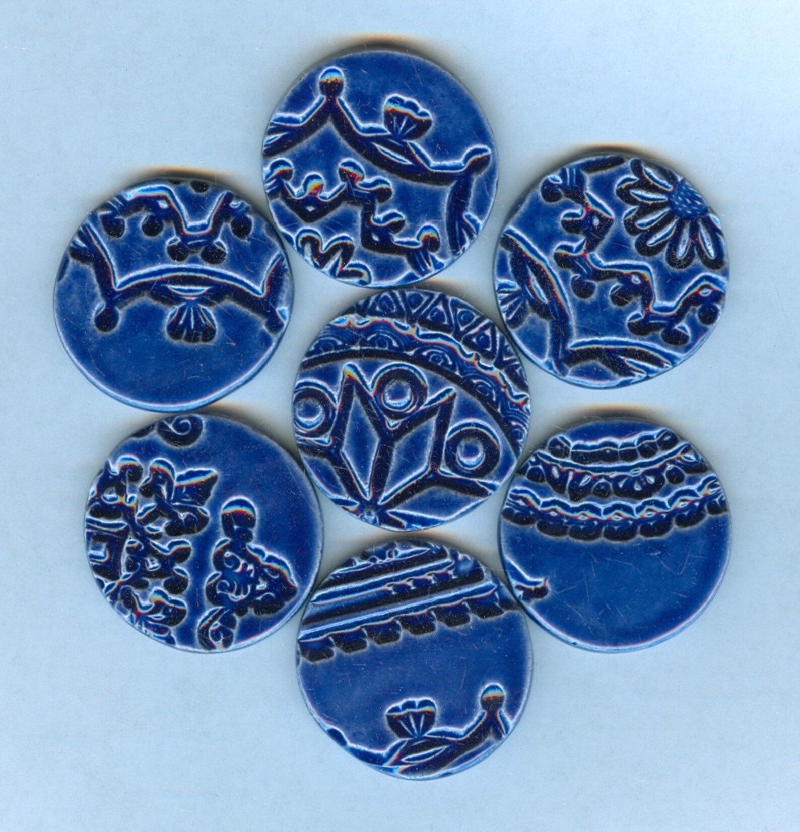7 handmade round embossed ceramic tiles with intricate designs Etsy