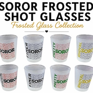 May include: Eight frosted glass shot glasses arranged in two rows. Each glass features a repeating pattern of the word SOROR in red, blue, or green, with specific words like DEVASTATING, FINER, PRETTY, and RHOYAL printed vertically in bold colors.