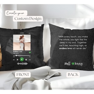 May include: Black decorative pillow with a custom design option. The front features a photo and music player graphic for "Endless Love." The back has a romantic quote and names. The pillow is on a white surface.