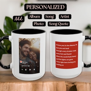 May include: A white ceramic mug with a black interior and handle. The mug features a photo of a couple and song lyrics. The text "PERSONALIZED" is at the top, with options to add album, song, artist, photo, and song quote.