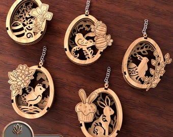 May include: Set of five laser cut wooden Easter egg decorations. Each decoration features a different design, including a bird, a bunny, a cross, and a cupcake. The decorations are all in shades of brown and have a rustic look.