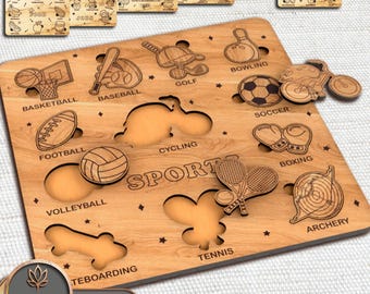May include: A wooden puzzle set with sports-themed cutouts, such as basketball, baseball, and football. The word "SPORT" is engraved in the centre. Additional smaller puzzles with food, jobs, and seasonal themes are included. The set is labelled "SET OF 7".