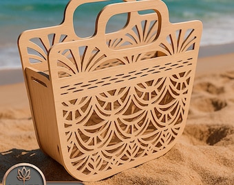 May include: A light-coloured wooden tote bag with intricate laser-cut patterns. The bag has two handles and a decorative design. The bag is on a sandy beach with the ocean in the background. The bag has the text "LASER BUILD.LAB TEMPLATE LASER CUT".