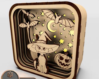 May include: A wooden Halloween-themed layered shadow box with a cat wearing a witch's hat, bats, stars, a crescent moon, and a jack-o'-lantern.