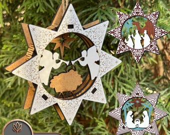 May include: Three laser cut wooden Christmas decorations in the shape of a star. The decorations feature a nativity scene with angels, a manger, and the three wise men. The decorations are painted in shades of brown, white, and red.