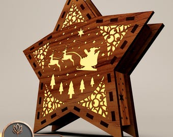 May include: A wooden star-shaped Christmas light with a laser-cut design of Santa Claus in his sleigh with reindeer flying through the air. The star has a decorative pattern around the edges and a small star in the centre.