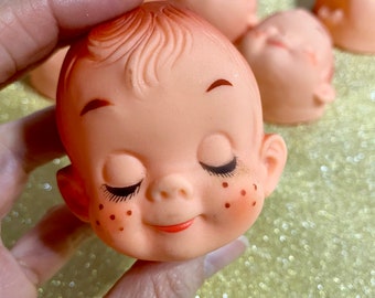 12 Vintage vinyl doll faces