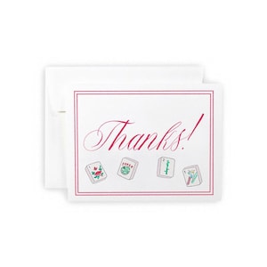 May include: White thank you card with a pink border and the word "Thanks!" in cursive. The card features four small, illustrated tiles with floral and number designs. A white envelope is behind the card.