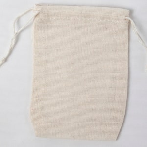 May include: A small, white cotton drawstring bag with a white cord.