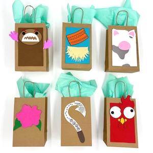 May include: Six brown paper gift bags with various character designs. Each bag has a teal tissue paper and a brown handle. The designs include a monster, a necklace, a cow, a flower, a fish hook, and a rooster.