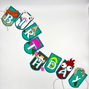 May include: A teal blue and brown birthday banner with the word "birthday" spelled out in white letters. Each letter has a different animal character on it. The banner is strung together with twine.
