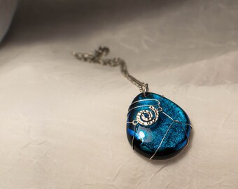 Tourquoise and Spring Green Spiral on black glass with rainbow dichroic glass center on sterling silver necklace by Deborah Tom
