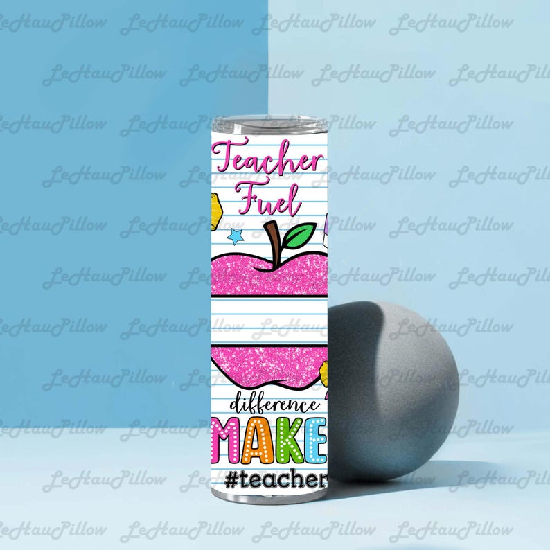 May include: A stainless steel tumbler with a colorful design for teachers. The tumbler features the words "Teacher Fuel" and "difference MAKE" with an apple graphic. The hashtag #teacher is also included.