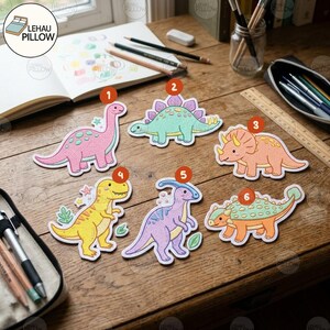 May include: Six embroidered dinosaur patches labeled one through six. The collection includes a pink long-necked dinosaur, a mint green Stegosaurus, an orange Triceratops, a yellow Tyrannosaurus, a purple Parasaurolophus, and an orange Ankylosaurus.