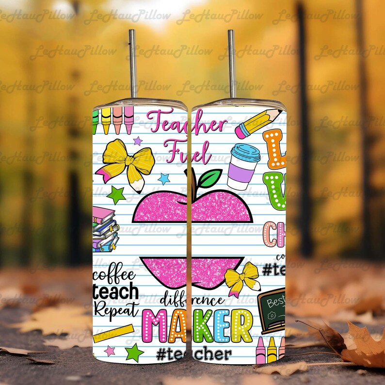 May include: A stainless steel tumbler with a straw, featuring a colorful design for teachers. The design includes an apple, pencils, coffee cup, and the words "Teacher Fuel" and "Maker". The tumbler is decorated with various school-themed graphics.