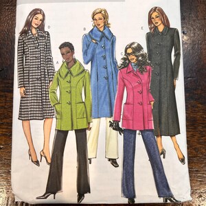 May include: A sewing pattern envelope featuring illustrations of five different coat styles labeled A through E. The designs include a black and white houndstooth coat, a lime green coat, a blue coat, a pink coat, and a long black coat.