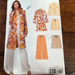 May include: A sewing pattern featuring a woman modeling a long, open coat with an orange and white floral pattern. The pattern also includes illustrations of a collared shirt, pants, shorts, and a skirt. The website address is visible at the bottom.