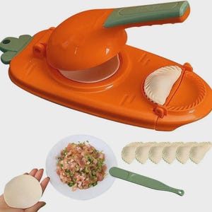 May include: Orange and green dumpling maker with a handle, shown with a plate of filling, dough, and finished dumplings. The dumpling maker has a hinged design and a crimped edge for sealing.