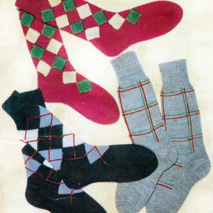 May include: A selection of vintage socks featuring different designs. One pair is red with green and white diamond patterns, another is black with grey and light blue diamonds, and a third pair is grey with red and green grid lines. The words "DIAMOND", "ARGYLL", and "OVERCHECK" are printed on the image.