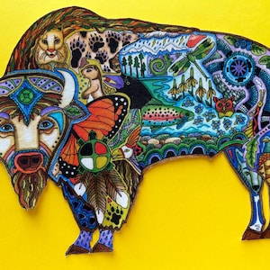 May include: A colorful illustration of a bison with intricate details. The bison is decorated with various animals, plants, and symbols, including a butterfly, a fish, a dragonfly, and a Native American medicine wheel. The background is a solid yellow color.