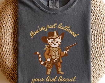 Camiseta divertida de gato vaquero: Vintage "Has untado con mantequilla tu última galleta"
