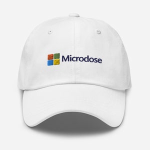 May include: White baseball cap with a blue embroidered logo that says "Microdose" and a colorful square logo that resembles the Windows logo.