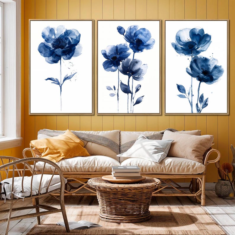 a living room filled with furniture and paintings on the wall