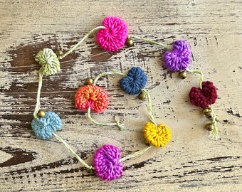 Knitted puffy heart hanging garland with bells