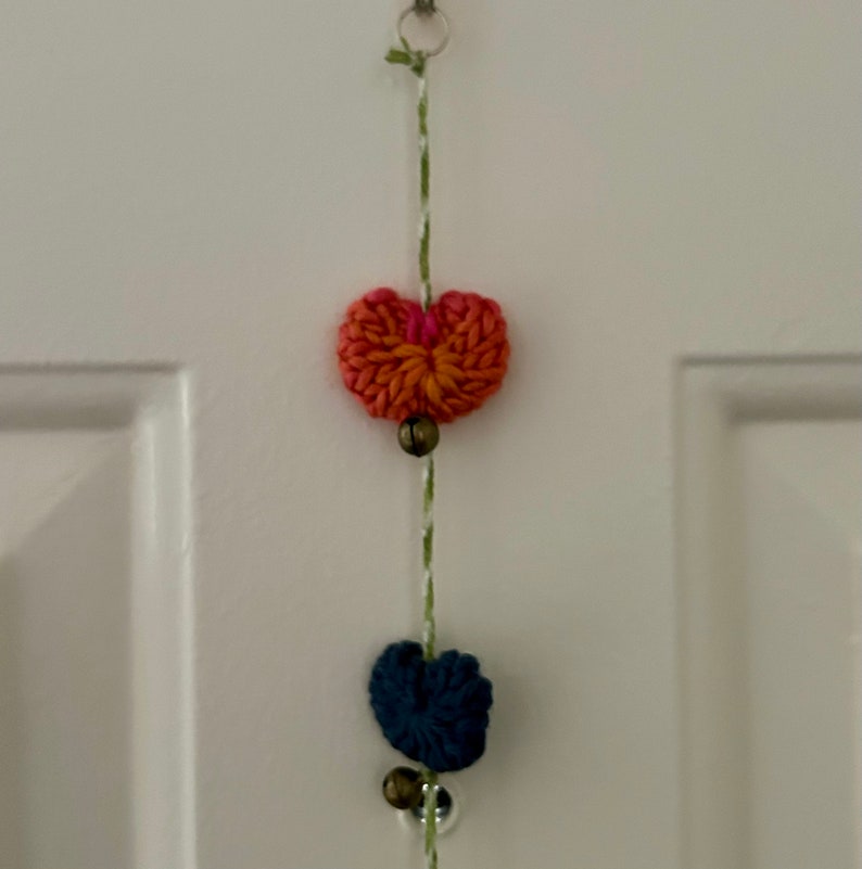 Knitted puffy heart hanging garland with bells image 6