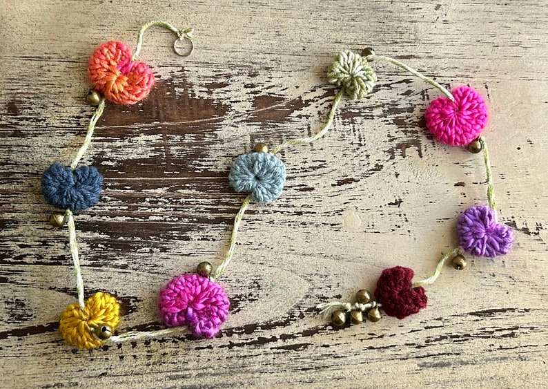 Knitted puffy heart hanging garland with bells image 9