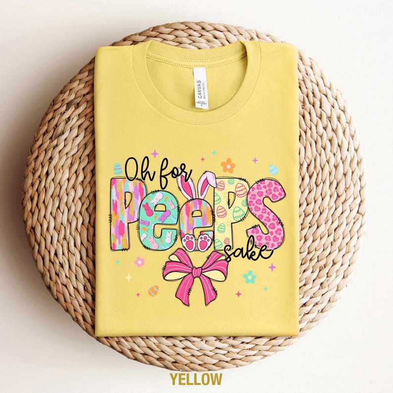 May include: Yellow t-shirt with a colorful graphic that says "Oh for Peeps sake".