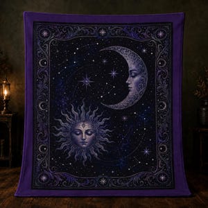 May include: A rectangular purple blanket featuring a central celestial design of a sun and a crescent moon with human faces. The dark background is filled with stars and constellations, all enclosed within an ornate, decorative border.