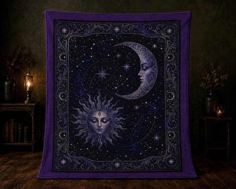 May include: A rectangular purple blanket featuring a central celestial design of a sun and a crescent moon with human faces. The dark background is filled with stars and constellations, all enclosed within an ornate, decorative border.