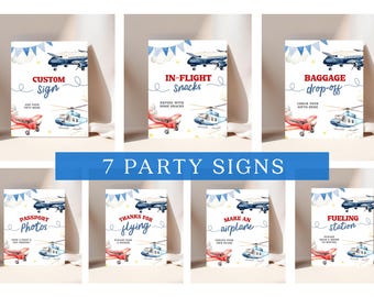 May include: Seven party signs with airplane and helicopter illustrations. Each sign features a different message, including "Custom Sign," "In-Flight Snacks," and "Baggage Drop-Off." The signs have a blue and red color scheme.